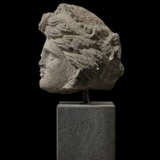 AN ETRUSCAN NENFRO FEMALE HEAD - photo 4