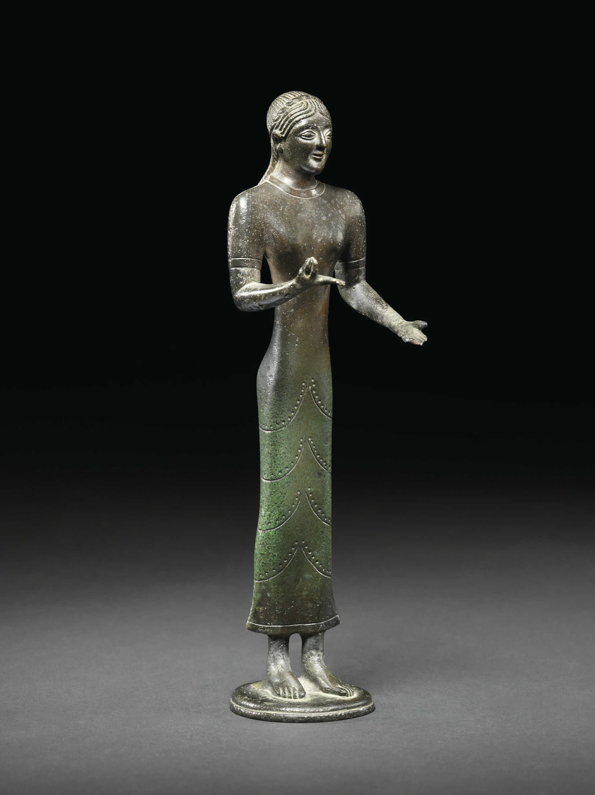 AN ETRUSCAN BRONZE KORE