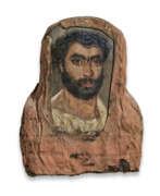 Painted. AN EGYPTIAN PAINTED WOOD MUMMY PORTRAIT OF A MAN