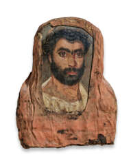 AN EGYPTIAN PAINTED WOOD MUMMY PORTRAIT OF A MAN