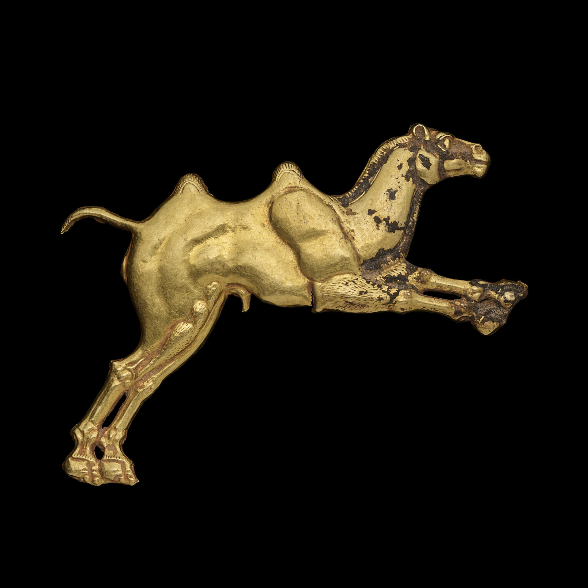 AN ACHAEMENID GOLD APPLIQUE OF A BACTRIAN CAMEL