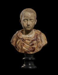 A ROMAN MARBLE POTRAIT HEAD OF A BOY AS WORSHIPPER OF ISIS