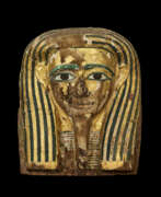 Spätzeit des Alten Ägyptens. AN EGYPTIAN PAINTED AND GILT WOOD MUMMY MASK