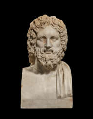 A ROMAN MARBLE HEAD OF A BEARDED GOD