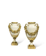 Pierre Gouthière (1732–1813). A PAIR OF LOUIS XVI ORMOLU-MOUNTED WHITE MARBLE VASES AND COVERS