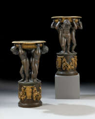 A LARGE PAIR OF REGENCY PATINATED AND LACQUERED-GILT-BRONZE FIGURAL TAZZE