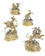 Gilding. A SET OF FOUR GERMAN PARCEL-GILT SILVER TABLE ORNAMENTS