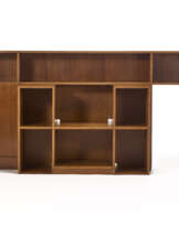Custom-designed low cabinet, consisting of two bodies, one symmetrical central body with open compartments, the other asymmetrical with a door cupboard and three open compartments
