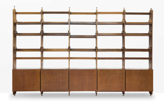 Custom-designed five-bay bookcase. 1960s. Solid and veneered wooden frame. Five two-door cabinets, fifteen hanging shelves, adjustable brass feet. (442.5x283x45.5 cm.) (slight defects) | | Provenance | Private collection, Como - photo 1