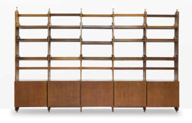 Custom-designed five-bay bookcase. 1960s. Solid and veneered wooden frame. Five two-door cabinets, fifteen hanging shelves, adjustable brass feet. (442.5x283x45.5 cm.) (slight defects) | | Provenance | Private collection, Como