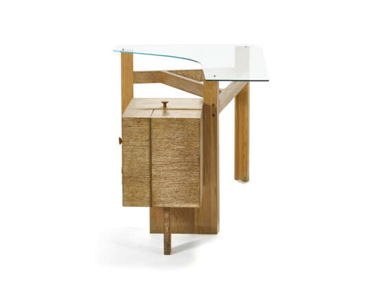 Tripod toilet with cabinet with one drawer and three door compartments. 1940. Solid and veneered bleached oak frame, tempered glass top. (100x66x71 cm.) (slight defects) | | Provenance | Casa F. Como | | Unique piece | | Literature | Luigi Zuc - photo 4