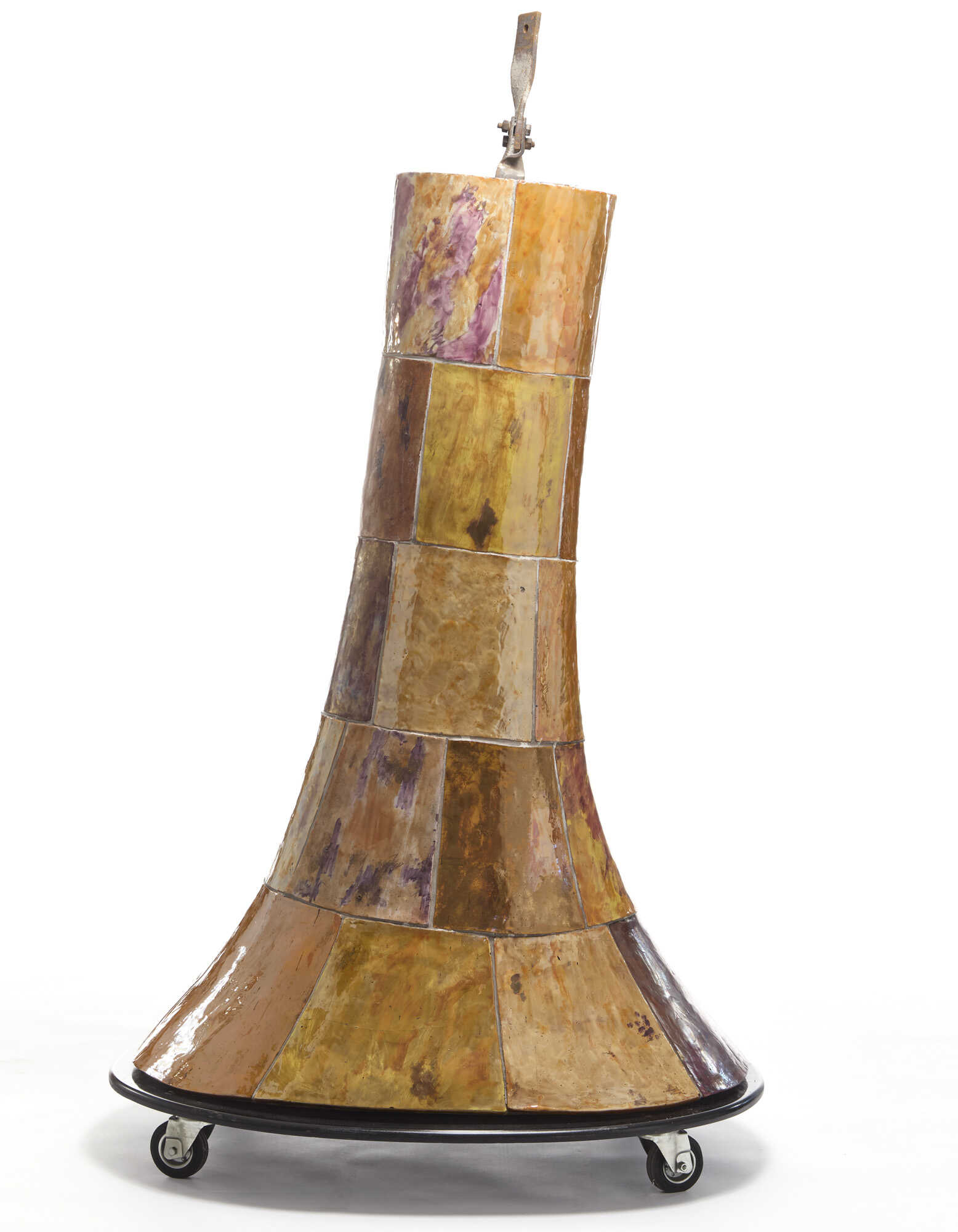 Conical chimney hood. 1953-54. Cement and iron cage frame, plastered on the inside with refractory mortars and covered on the outside with luster majolica elements modelled by Melotti. The elements are different from each other, both in shape and dec