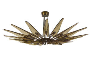 Sixteen-light chandelier model "1563 A Dhalia". Produced by Fontana Arte,, 1950s. Brass frame, metal and aluminium, bevelled transparent amber crystals. (h 50 cm.; d 127 cm.) (slight defects) | | Provenance | Private collection, Cantù | | Literat