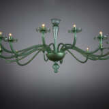 Large fourteen-arm chandelier. Execution by V.S.M. Cappellin Venini & C. 1921-25ca. Transparent light green blown glass. (h cm 195; d cm 230) | | The chandelier is referable to drawing no. 2011 and no. 2018 in the VSM Cappellin Venini catalogue and - photo 3