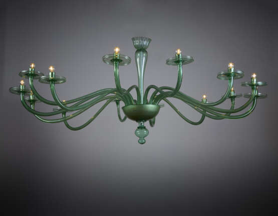Large fourteen-arm chandelier. Execution by V.S.M. Cappellin Venini & C. 1921-25ca. Transparent light green blown glass. (h cm 195; d cm 230) | | The chandelier is referable to drawing no. 2011 and no. 2018 in the VSM Cappellin Venini catalogue and - photo 3