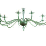 Large fourteen-arm chandelier. Execution by V.S.M. Cappellin Venini & C. 1921-25ca. Transparent light green blown glass. (h cm 195; d cm 230) | | The chandelier is referable to drawing no. 2011 and no. 2018 in the VSM Cappellin Venini catalogue and - photo 7