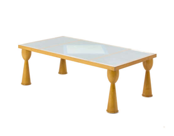 Coffe table model "Filicudi". Produced by Zanotta,, 1990s. Wooden frame and silk-screened melamine top with geometric design. Bearing label under the top. (128.5x42.5x70 cm.) (slight defects) | | Provenance | Private collection, Italy - photo 2