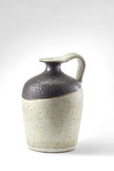 Small enamelled stoneware jug in shades of white and brown. 1970s. Signed under the base "Gambone Italy". (h 13.5 cm.)