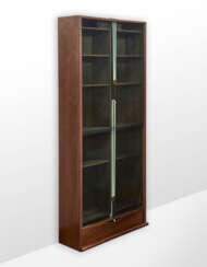 Bookcase model "Zibaldone". Produced by Bernini, Italy, 1974. Solid and veneered wood, green glass doors sliding vertically on counterweighted straps. (116x258x40 cm.) (minor defects and upper break at one side) | | Literature | G. Gramigna, Repert