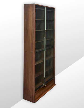 Bookcase model "Zibaldone". Produced by Bernini, Italy, 1974. Solid and veneered wood, green glass doors sliding vertically on counterweighted straps. (116x258x40 cm.) (slight defects) | | Literature | G. Gramigna, Repertorio del design italiano 19 - photo 1