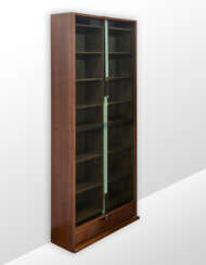 Bookcase model "Zibaldone". Produced by Bernini, Italy, 1974. Solid and veneered wood, green glass doors sliding vertically on counterweighted straps. (116x258x40 cm.) (slight defects) | | Literature | G. Gramigna, Repertorio del design italiano 19