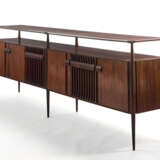 (Attributed) | Sideboard. 1960s. Six doors and six legs, double top shelf. Solid and veneered dark wood. (302.3x103x47 cm.) | | Provenance | Private collection, Cantù - фото 1