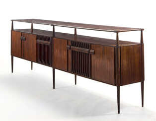 (Attributed) | Sideboard. 1960s. Six doors and six legs, double top shelf. Solid and veneered dark wood. (302.3x103x47 cm.) | | Provenance | Private collection, Cantù