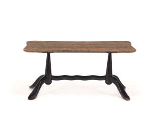Coffee table with ebonised wooden frame and shaped red marble top. Italy, 1940s. (110x50x50 cm.) (minor defects and small restorations)