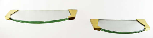 Two consoles model "2034". Milan, 1950s. Thick bevelled crystal, brass supports. (l cm 61.5 e cm 51.5) (slight defects and restoration) | | Literature | Arredamento, "Quaderni Fontana Arte", n. 2, Milano s.d. p. 42 - Foto 1