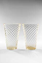 Pair of colourless blown glass vases with gold leaf application. Murano, 1950s. One signed with acid under the base. (h 26 cm.) | | Provenance | Private collection, Milan