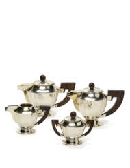 Silver Art Déco tea and coffee service. Title 800. Italy, 1920s/1930s. Consisting of: teapot, coffee pot, milk jug and sugar bowl with lid, wooden handles. Unidentified silversmith. (g gross 1100) (minor defects and small restorations)