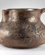 Пьетро Меландри. Enamelled ceramic pourer decorated with relief motifs in shades of brown and green with strong irridation