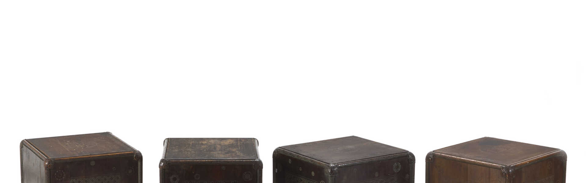 Four carved wooden small tables with geometric plant motifs. 1920s. (47x42x43 cm.) (defects and losses)