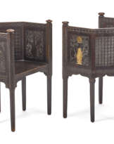Pair of carved, ebonised and gilded wooden armchairs with partially gilded geometric plant decorations