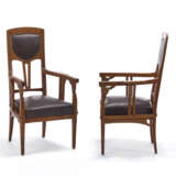 Pair of Liberty armchairs. Milan, early 20th century. Solid wood carved, threaded and inlaid with different woods. Seat and back covered in brown leather. (54x101x50 cm.) (slight defects) - фото 1