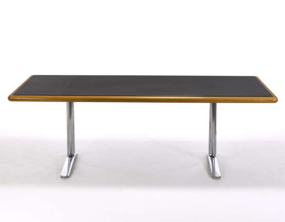 Desk with top covered in black leather and edged in solid oak wood, chromed metal supports. Produced by Knoll International,, 1973. (227x76x110 cm.) (slight defects) - фото 1