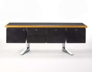 Sideboard with four drawers and two side doors upholstered in black leather, chromed metal tubular support and top edged in solid oak wood and leather. Produced by Knoll International,, 1973. (194x75x60 cm.) (defects and losses)
