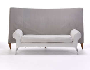 Sofa model "Royalton". Produced by Driade, Italy, 1988 ca. Steel frame, front legs in polished cast aluminium and back legs in solid wood, upholstery in grey synthetic velvet and white fabric. (210x113x100 cm.) (slight defects)