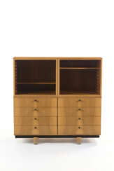 Modular cabinet of the series "Ovunque ". Produced by Bernini,, 1980s. Eight drawers and two display cabinets. Painted metal frame and solid and veneered walnut wood, smoked glass, plastic handles bearing the manufacturer's logo. (110x110.5x60 cm.) (