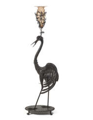 "Airone" | Wrought iron and embossed sheet iron sculpture holding a Murano glass flower vase. Italy, 1920s. (h 150 cm.) (slight defects)