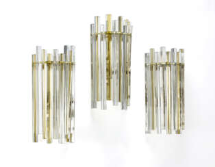 Three wall lamps of the series "Trilobo". Murano, 1970s. Metal frame, colourless sommerso glass pendants. (h 42.5 cm.) (defects)
