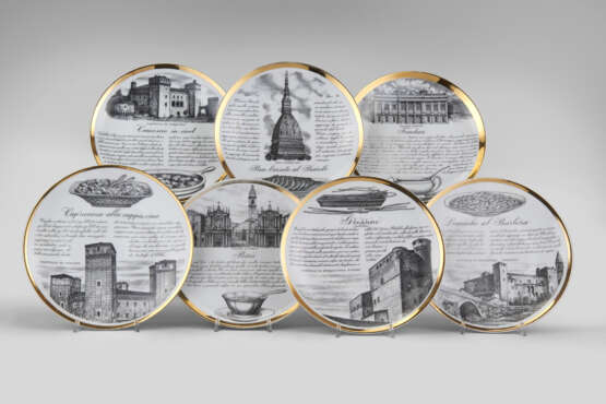 Seven plates of the series "Specialità torinesi". Milan, 1960s. Porcelain, black and gold lithographic print. Marked on verso. (d 24 cm.) (slight defects) - photo 1