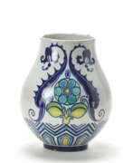 Decor. Bulb-shaped enamelled ceramic vase with cobalt blue, light blue, yellow and green geometric decorations and with two tritons and flower on a white under glaze background. Mugello, 1920s. Marked in blue under the base: "CHINI E C / MUGELLO / (ITALIA)"
