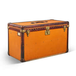 AN ORANGE VUITTONITE CANVAS STEAMER TRUNK WITH BRASS HARDWARE