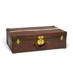 A NATURAL COWHIDE LEATHER SUITCASE WITH BRASS HARDWARE