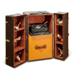 A MONOGRAM CANVAS LIBRARY TRUNK WITH BRASS HARDWARE