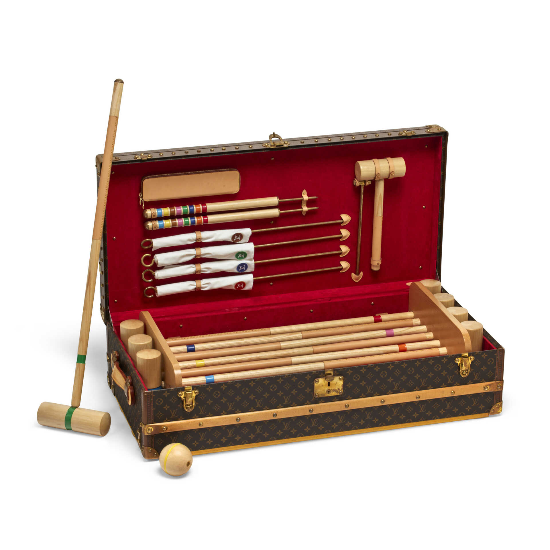 A SPECIAL ORDER MONOGRAM CANVAS CROQUET TRUNK WITH BRASS HARDWARE