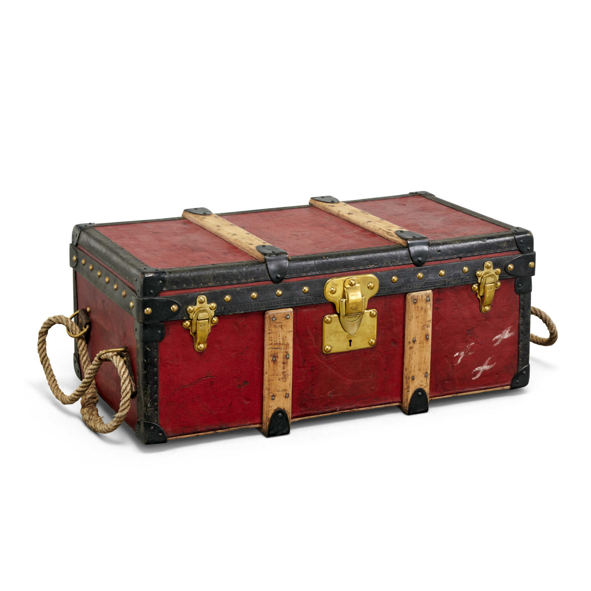 A RED VUITTONITE CANVAS TRUNK WITH BRASS HARDWARE