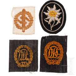 Vier Textilabzeichen