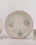 Décor. Part of a service consisting of two bowls, a cup and saucer and an egg cup in porcelain decorated with circus figures